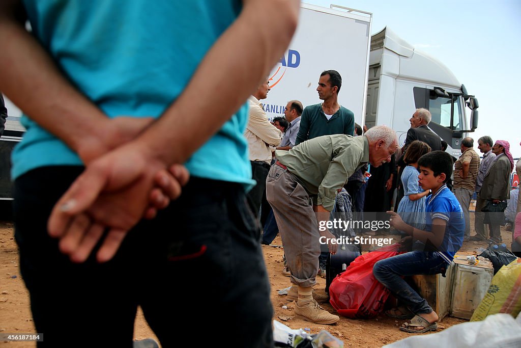 Syrian Kurds Fleeing The Islamic State Militants Cross Into Turkey