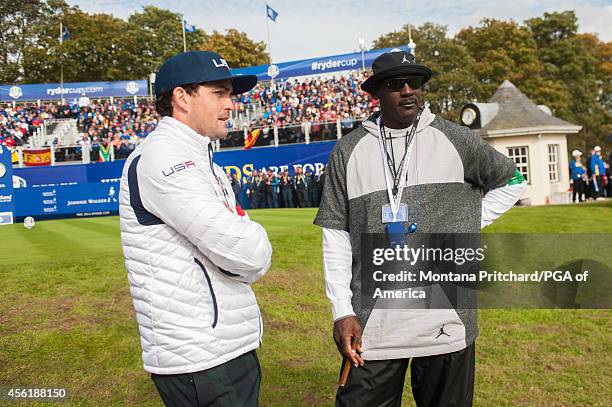 Keegan Bradley of the United States talks with Michael Jordan on the first tee during the foursome matches for the 40th Ryder Cup at Gleneagles, on...