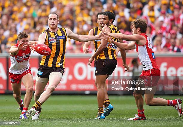 Jarryd Roughead of the Hawks kicks during the 2014 AFL Grand Final match between the Sydney Swans and the Hawthorn Hawks at Melbourne Cricket Ground...