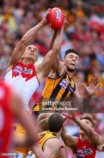 Ted Richards of the Swans marks infront of Jack Gunston of the Hawks during the 2014 AFL Grand Final match between the Sydney Swans and the Hawthorn...