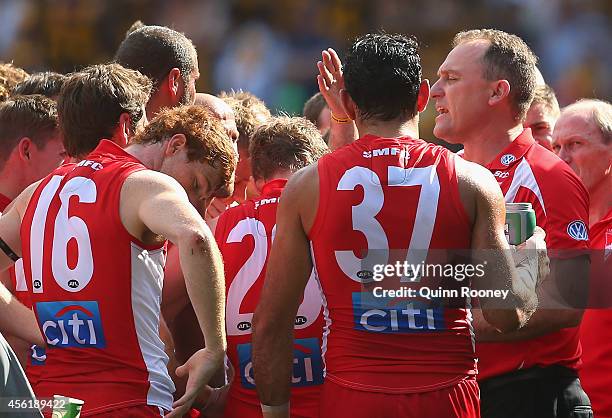 Head coach John Longmire of the Swans talks to his players during the 2014 AFL Grand Final match between the Sydney Swans and the Hawthorn Hawks at...