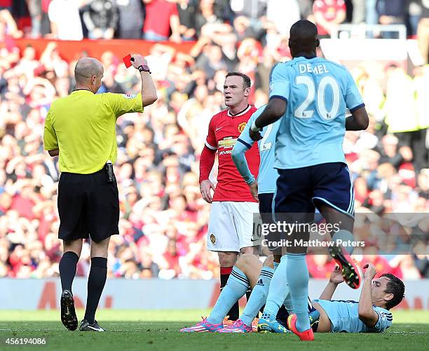 Wayne Rooney of Manchester United is sent off by referee Lee Mason during the Barclays Premier League match between Manchester United and West Ham...