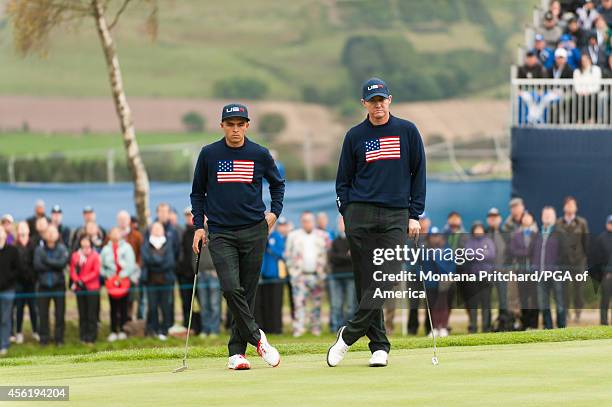 Rickie Fowler and Jimmy Walker of the United States wait to putt on four during the foursome matches for the 40th Ryder Cup at Gleneagles, on...