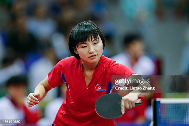 Kim Jong of North Korea competing against Maryam S B A Abdulraheem of Kuwait in Table Tennis Women's Team Preliminary Round Group D during day eight...