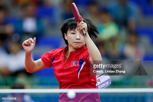 Kim Jong of North Korea competing against Maryam S B A Abdulraheem of Kuwait in Table Tennis Women's Team Preliminary Round Group D during day eight...