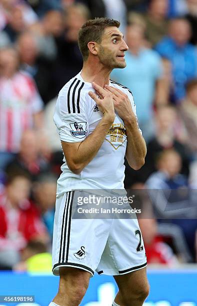 Angel Rangel of Swansea appeals against his red card during the Barclays Premier League match between Sunderland and Swansea City at The Stadium of...