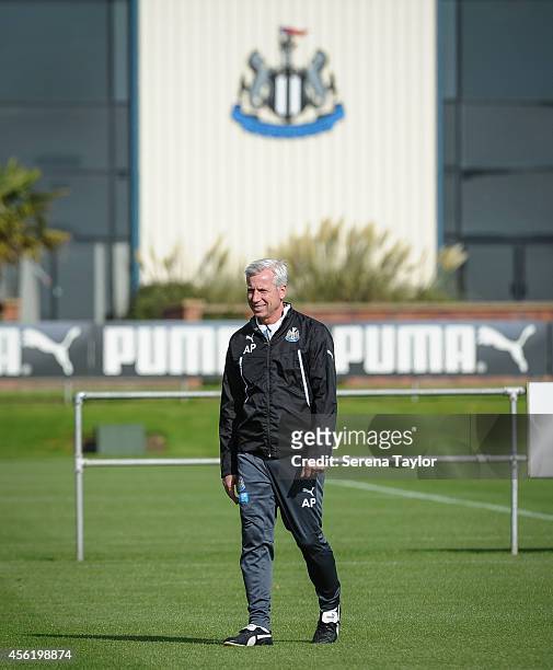 Manager Alan Pardew walks on to the training pitch during a training session at The Newcastle United Training Centre on September 27 in Newcastle...