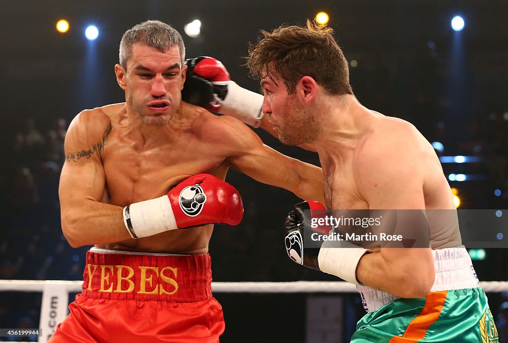 Boxing Gla Jose Yebes of Spain exchange punches with Matthew Macklin of Great ...