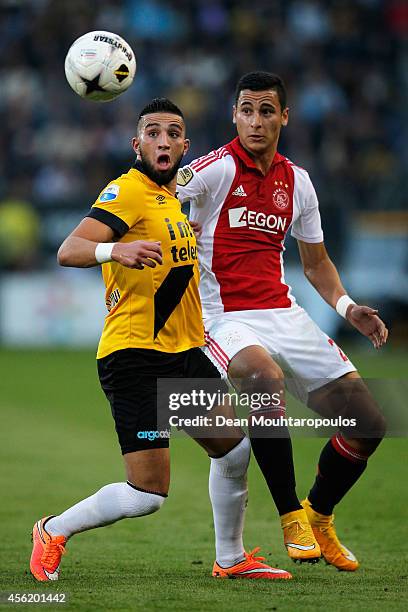 Adnane Tighadouini of NAC and Anwar El Ghazi of Ajax battle for the ball during the Dutch Eredivisie match between NAC Breda and Ajax Amsterdam at...