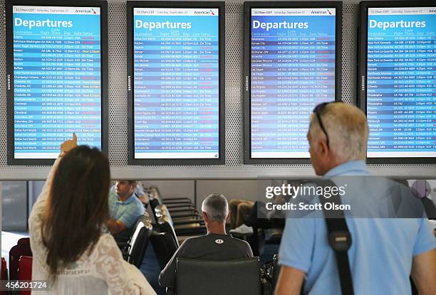 The arrival and departure display at O'Hare International Airport shows a list of cancelled flights on September 27, 2014 in Chicago, Illinois....