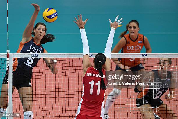 Robin De Kruijf of Netherlands spikes as Ekaterina Gamova of Russia blocks during the FIVB Women's World Championship pool C match between Russia and...