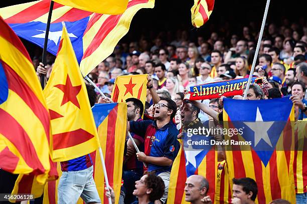 Barcelona fans waves Pro-Independence Catalan flags during the La Liga match between FC Barcelona and Granada CF at Camp Nou on September 27, 2014 in...