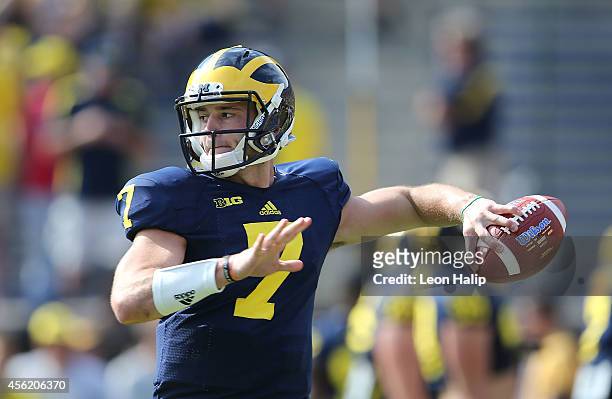 Quarterback Shane Morris of the Michigan Wolverines warms up prior to the start of the game against the Minnesota Golden Gophers at Michigan Stadium...