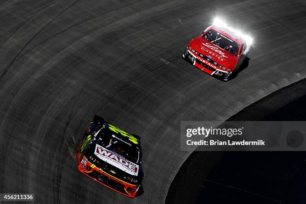 Ryan Sieg, driver of the Kevin Wade US Senate/Little Caesars Chevrolet, leads Ryan Reed, driver of the ADA Drive to Stop Diabetes presented by Lilly...