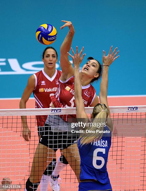 Kubra Akman of Turkey spikes the ball against to Thaisa Menezes of Brazil during the FIVB Women's World Championship pool B match between Brazil and...