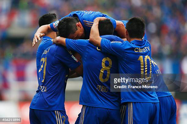 Sebastian Ubilla of U de Chile celebrates with teammates after scoring his team's second goal during a match between Audax Italiano and U de Chile as...
