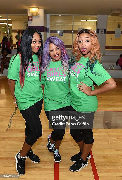 Bahja Rodriguez, Breaunna Womack, and Zonnique Pullins of OMG Girlz at Andrew & Walter Young YMCA on September 27, 2014 in Atlanta, Georgia.