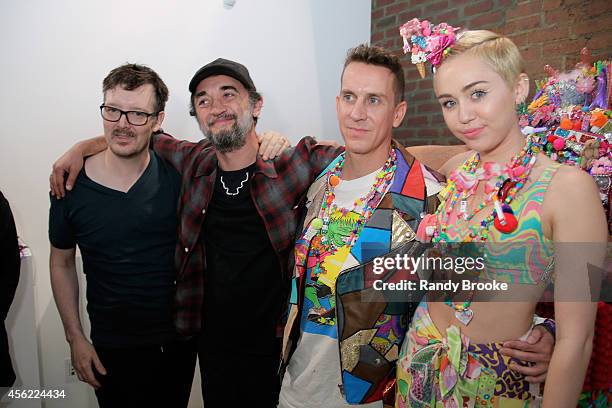 Make-up artist Kabuki , Hair stylist Eugene Souleiman with Jetremy Scott and Miley Cyrus backstage before the Jeremy Scott fashion show during MADE...