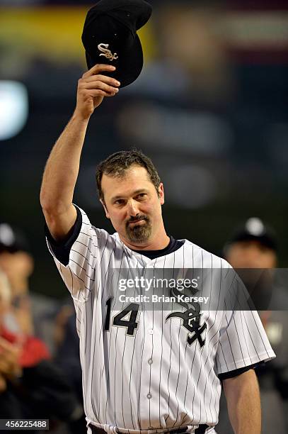 Paul Konerko of the Chicago White Sox tips his hat to the fans during a pre game ceremony honoring his career before the game against the Kansas City...