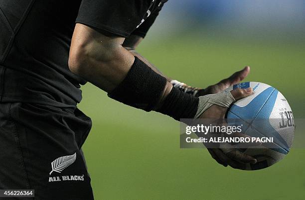 New Zealand's All Blacks' scrum half Aaron Smith holds the ball during their Rugby Championship fifth round match against Argentina's Los Pumas, at...