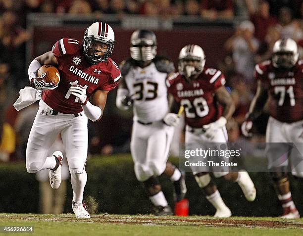 South Carolina wide receiver Pharoh Cooper gets a first down after a catch in the first half against Missouri at Williams-Brice Stadium in Columbia,...