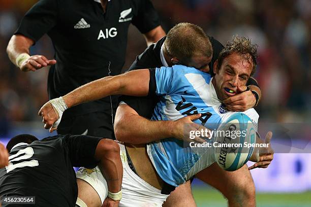 Benjamin Macome of the Pumas is tackled during The Rugby Championship match between Argentina and the New Zealand All Blacks at Estadio Ciudad de La...