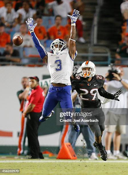 Corn Elder of the Miami Hurricanes defends as Jamison Crowder of the Duke Blue Devils is unable to catch the ball on September 27, 2014 at Sun Life...