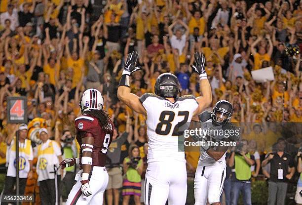 South Carolina linebacker Sharrod Golightly reacts as Missouri tight end Clayton Echard and wide receiver Bud Sasser celebrate their final touchdown...