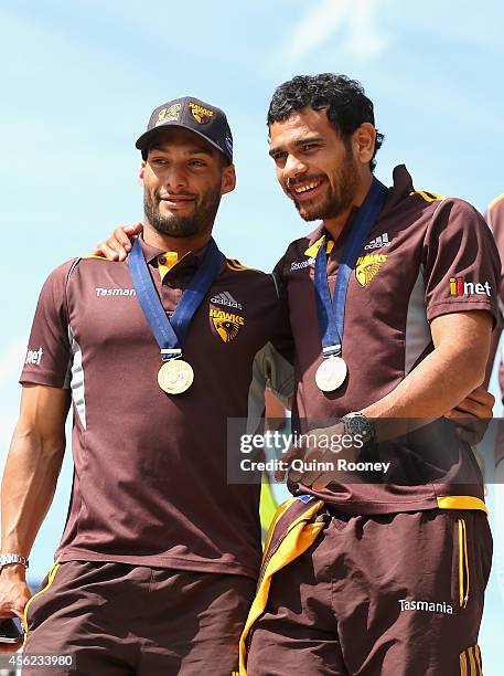 Josh Gibson and Cyril Rioli of the Hawks arrive for the Hawthorn Hawks AFL team celebration at Glenferrie Oval on September 28, 2014 in Melbourne,...