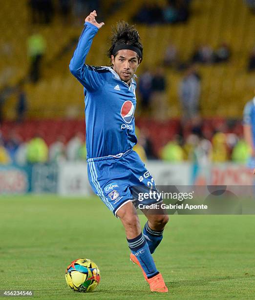 Fabian Vargas of Millonarios drives the ball during a match between Millonarios and Fortaleza as part of Liga Postobon 2014 at Nemesio Camacho El...