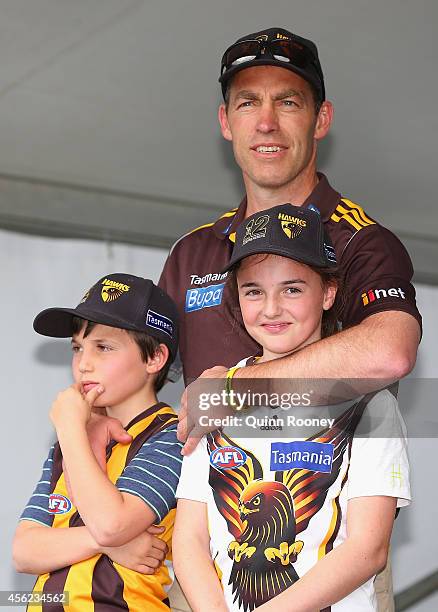 Alastair Clarkson the coach of the Hawks stands with his kids during the Hawthorn Hawks AFL team celebration at Glenferrie Oval on September 28, 2014...