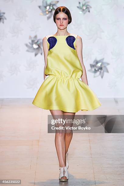 Model walks the runway during the Tsumori Chisato show as part of the Paris Fashion Week Womenswear Spring/Summer 2015 on September 27, 2014 in...