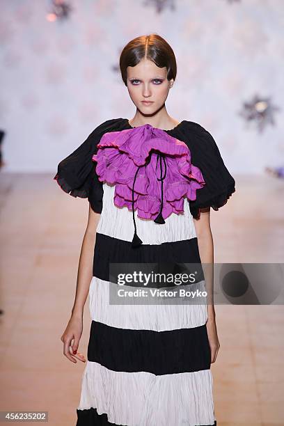 Model walks the runway during the Tsumori Chisato show as part of the Paris Fashion Week Womenswear Spring/Summer 2015 on September 27, 2014 in...