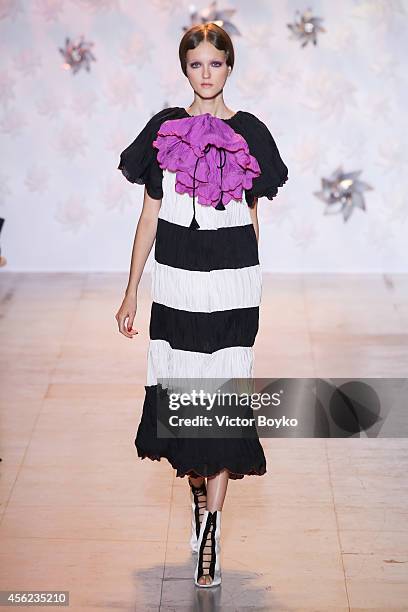 Model walks the runway during the Tsumori Chisato show as part of the Paris Fashion Week Womenswear Spring/Summer 2015 on September 27, 2014 in...