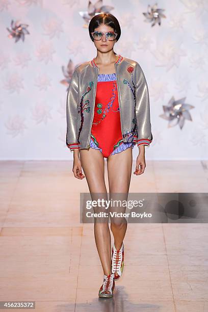 Model walks the runway during the Tsumori Chisato show as part of the Paris Fashion Week Womenswear Spring/Summer 2015 on September 27, 2014 in...