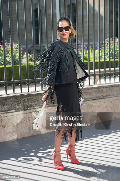 Fashion Writer and TV Presenter Tiany Kiriloff is wearing a Malene Birger jacket and dress, Delvaux bag, Aperlai shoes and Louis Vuitton sunglasses...