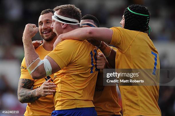 Quade Cooper of Brisbane City celebrates with try scorer Marco Kotze during the round six NRC match between Brisbane City and Queensland Country at...