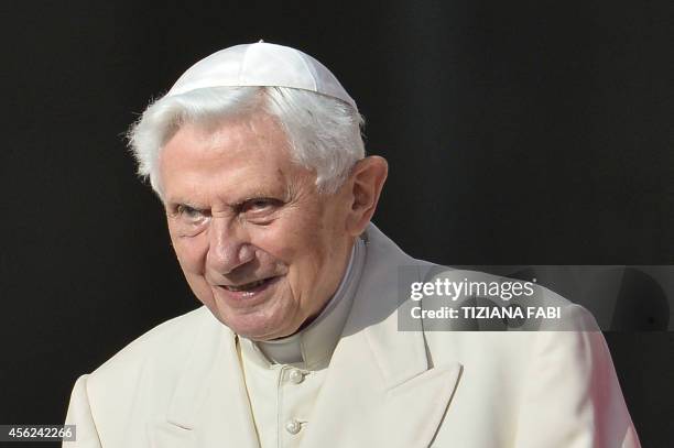 Pope emeritus Benedict XVI attends a papal mass for elderly people at St Peter's square on September 28, 2014 at the Vatican. AFP PHOTO / TIZIANA FABI