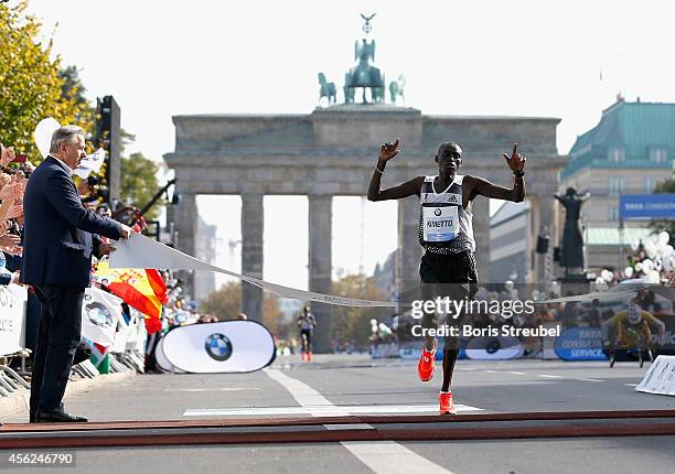 Dennis Kimetto of Kenya crosses the finish line in new world record time during the 41th BMW Berlin Marathon on September 28, 2014 in Berlin, Germany.