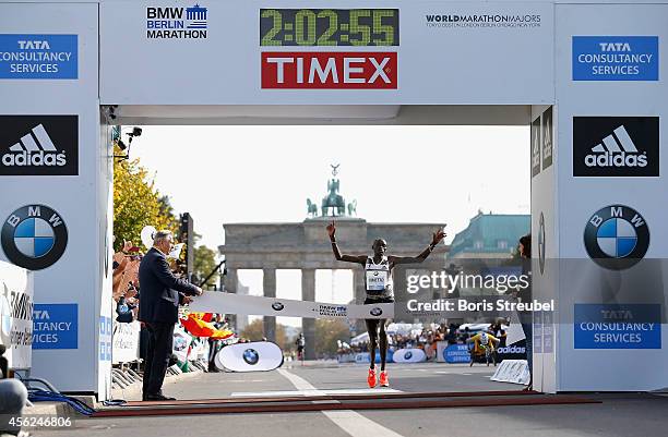 Dennis Kimetto of Kenya crosses the finish line in new world record time during the 41th BMW Berlin Marathon on September 28, 2014 in Berlin, Germany.