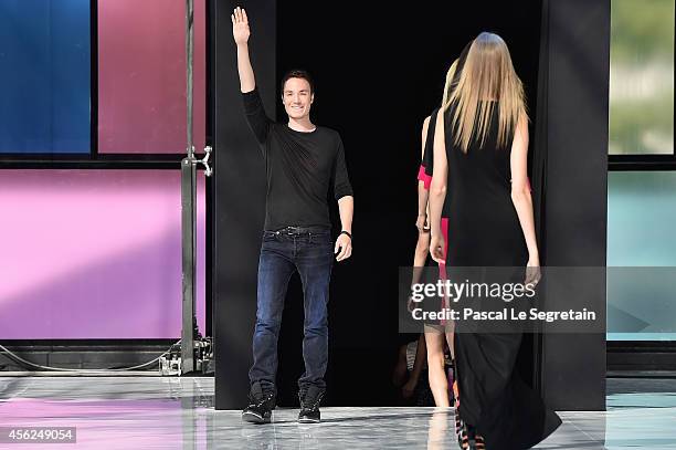 Fashion designer Maxime Simoens acknowledges the applause of the audience after the Maxime Simoens show as part of the Paris Fashion Week Womenswear...