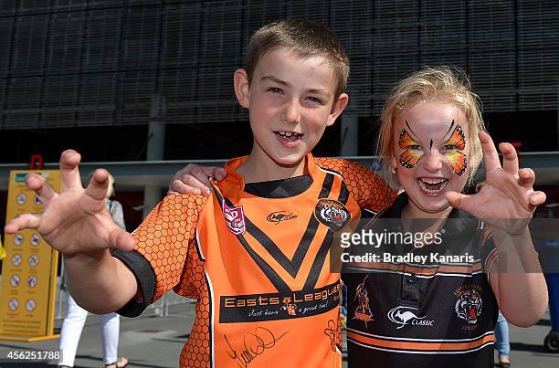 Young Tigers fans Edward Lesley and Katelyn Lesley pose for a photo before the Intrust Super Cup Grand Final match between Northern Pride and Easts...