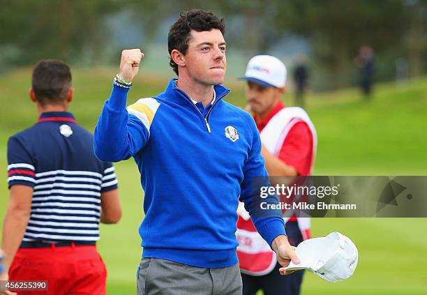 Rory McIlroy of Europe celebrates victory on the 14th hole during the Singles Matches of the 2014 Ryder Cup on the PGA Centenary course at the...