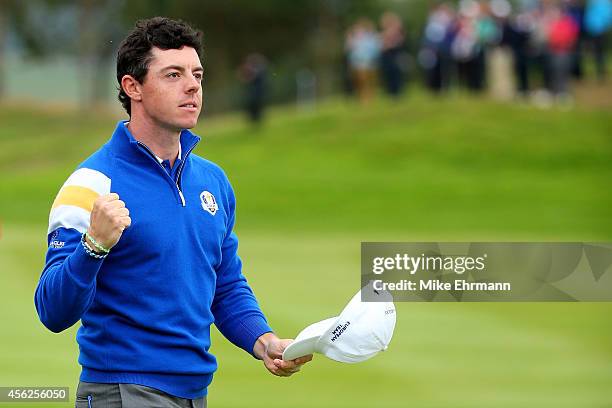Rory McIlroy of Europe celebrates victory on the 14th hole during the Singles Matches of the 2014 Ryder Cup on the PGA Centenary course at the...