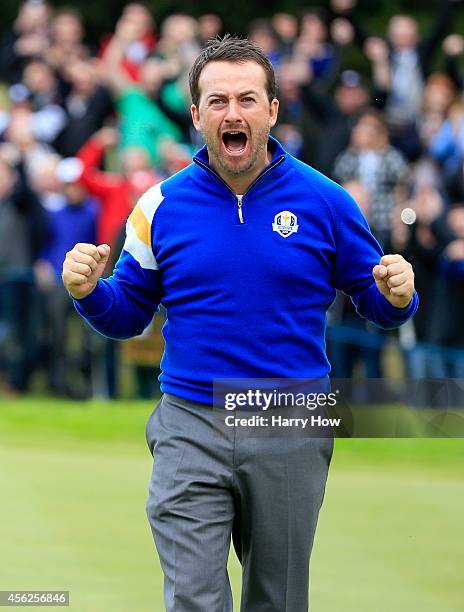 Graeme McDowell of Europe celebrates victory against Jordan Spieth of the United States on the 17th hole during the Singles Matches of the 2014 Ryder...