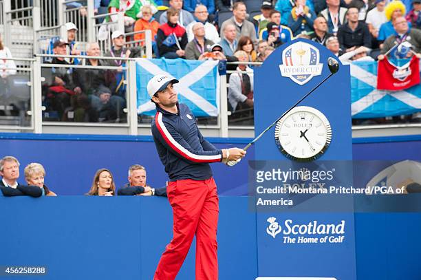Keegan Bradley of the United States hits his tee shot on the first tee during the singles matches for the 40th Ryder Cup at Gleneagles, on September...