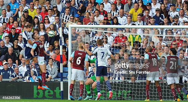 Player Craig Dawson heads in the first goal during the Barclays Premier League match between West Bromwich Albion and Burnley at The Hawthorns on...