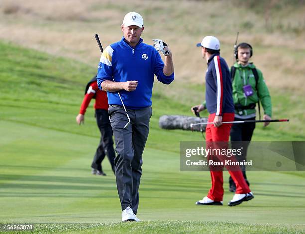 Jamie Donaldson of Europe walks down the 15th fairway shortly before Europe won the Ryder Cup after Donaldson defeated Keegan Bradley of the United...