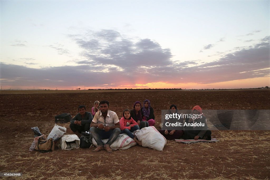 Syrian Kurdish family cross into Turkey through Yumurtalik border cross in Sanliurfa