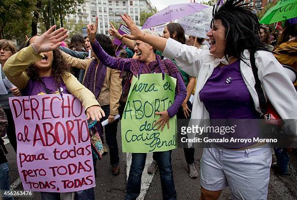 Women holding sings supporting women's abortion right dance during a demonstration supporting reproductive rights for women on September 28, 2014 in...